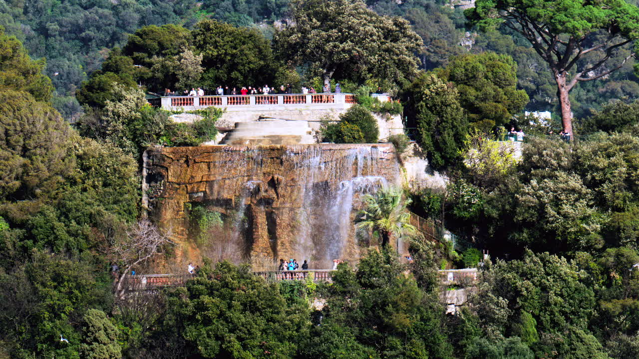 Nice, France - March 17, 2025: Distant view of the Cascade du Chateau on the Chateau hill in daylight