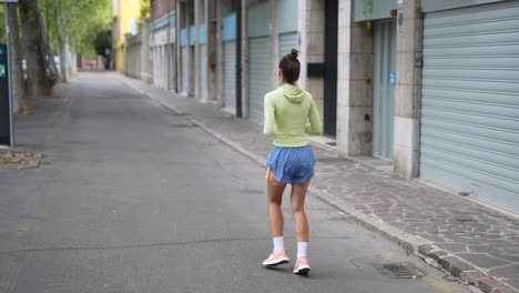 woman running in city street