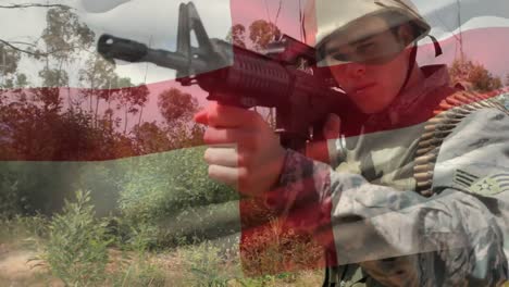 Digital-composition-of-waving-england-flag-against-soldier-training-with-a-gun-at-training-camp