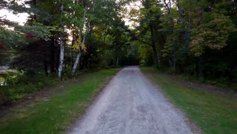 A-pan-in-shot-of-a-dirt-road-in-fall