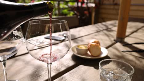 red wine being poured into a glass