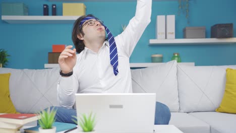 lazy funny guy doesn't want to do business. he plays with a paper airplane.