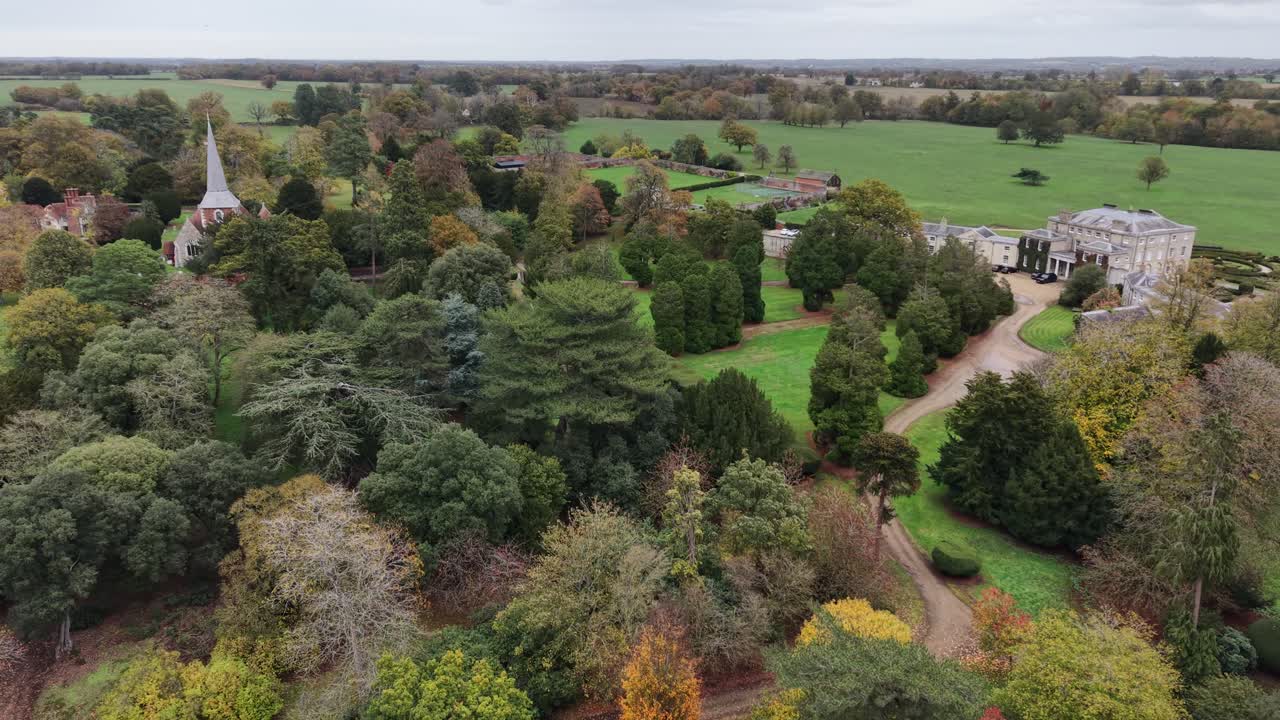 Terling place mansion , Essex UK autumn pull back drone aerial reverse reveal