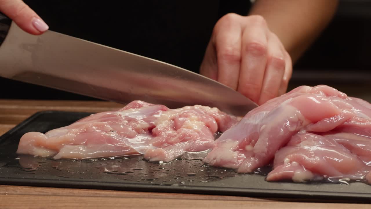 Cutting raw chicken