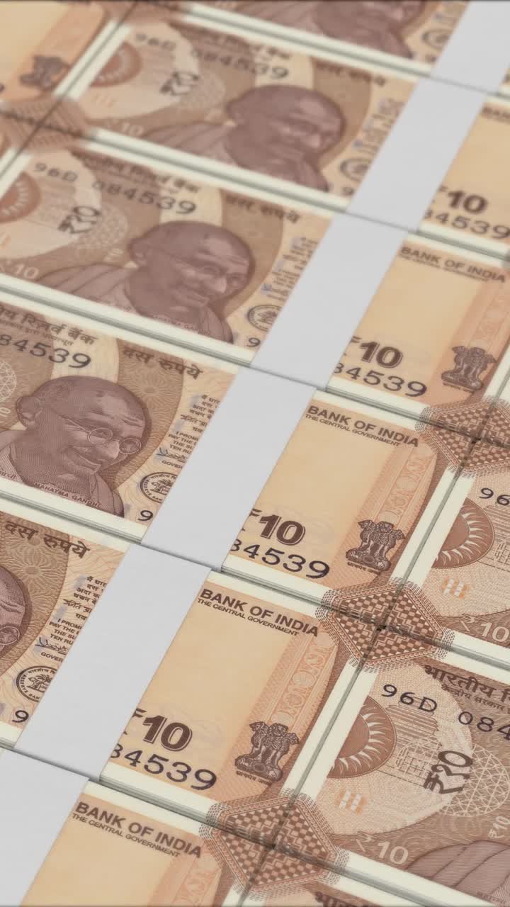 vídeo vertical de billetes de 10 rupias impresos por una imprenta de dinero