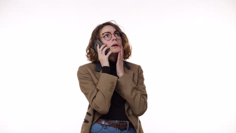 Confused-european-woman-holding-cell-phone-having-problem-with-the-calling-person,-frustrated-angry-girl-received-bad-news-at