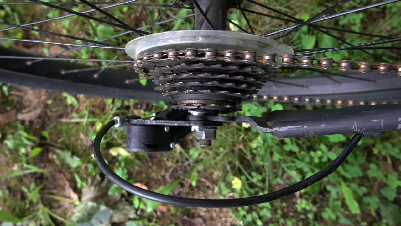 Close up from bicycle cassette with tooth and rusty chain from top