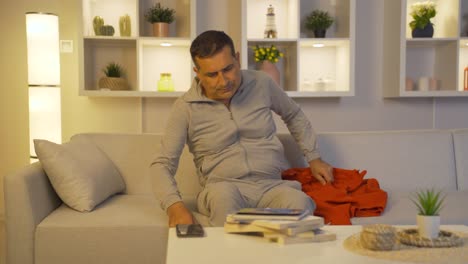 the man lying down and resting relaxes and unwinds.