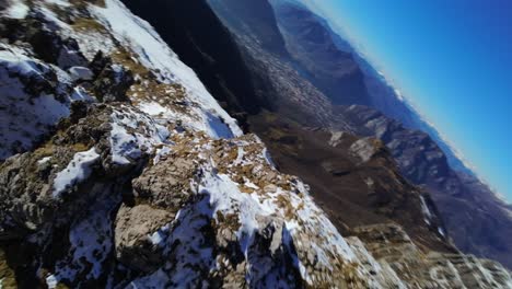 High-speed-aerial-fpv-drone-view-over-Resegone-snowy-mountain-of-Italian-Alps-in-northern-Italy