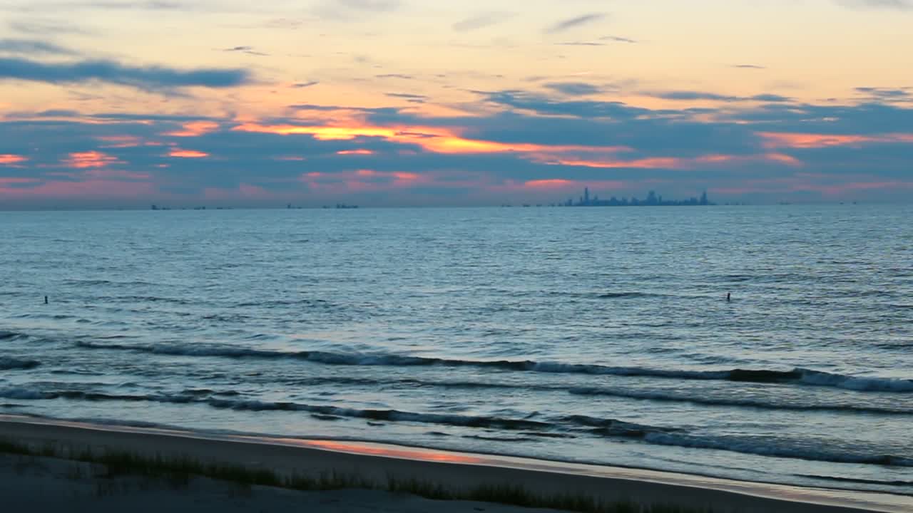 Sunset over Lake Michigan with Chicago skyline seen from Indiana Dunes National Park, USA