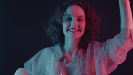 woman dancing under neon light