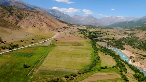 vast farmland on countryside near mountain urunghach lake in uzbekistan
