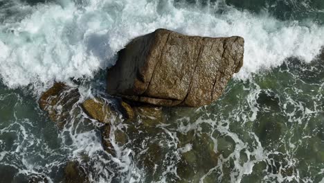 Ocean waves crashing on a rock