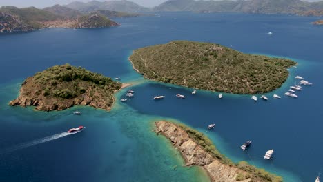 Aerial-footage-of-island-groups-in-south-America-with-moving-water-traffic-and-yachts-boats-docked-around-the-shore