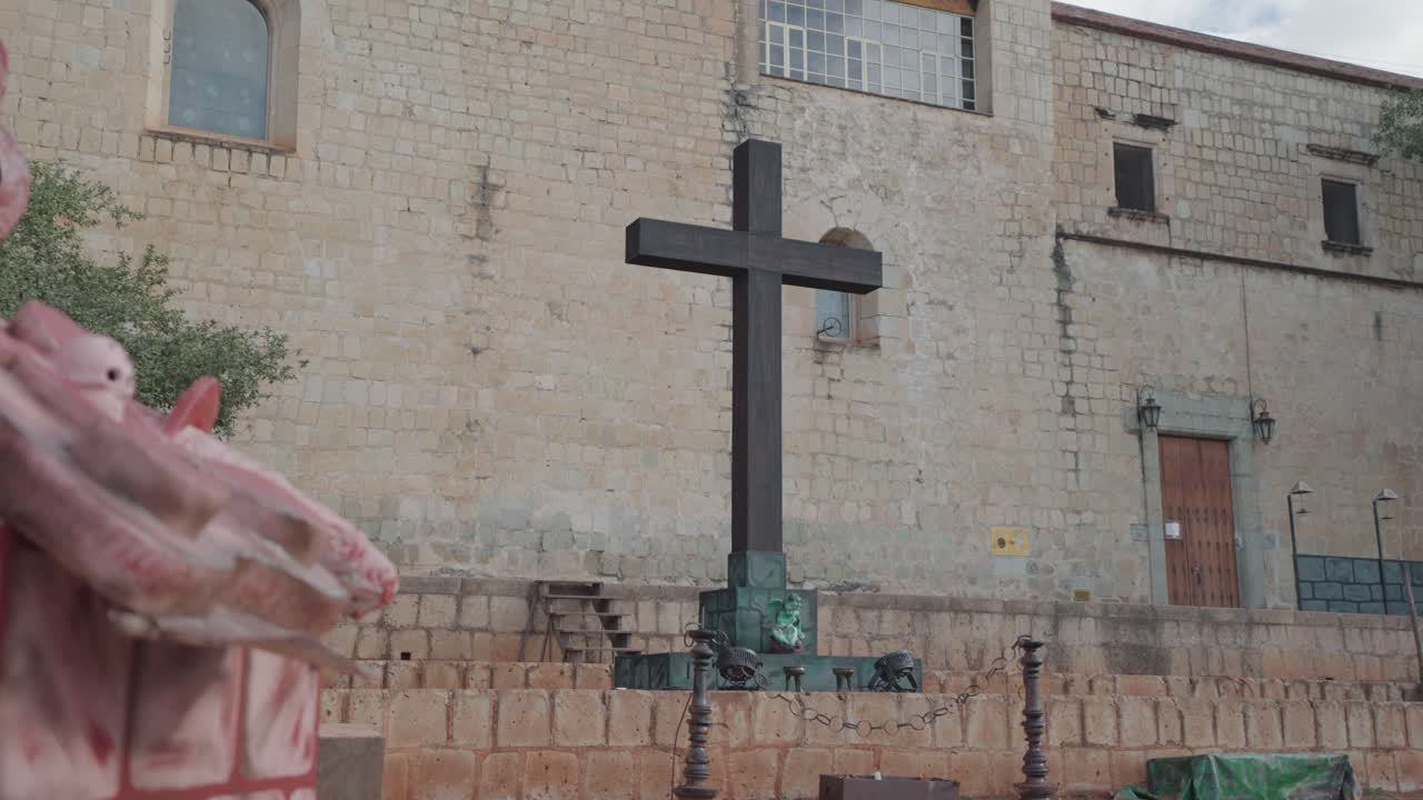Religious monument in front of old building