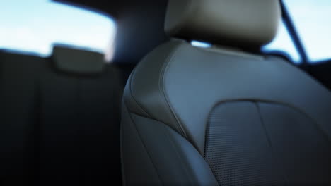 close up of a black leather car seat