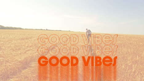 animación de las palabras buenas vibraciones escritas en naranja con un hombre caminando en un campo de maíz iluminado por el sol