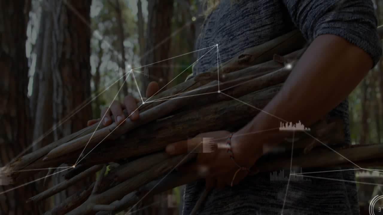 Man carrying dry branch bundle in pine forest, overlaying network lines and data points for tech