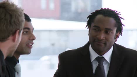 three business people talking in a business meeting