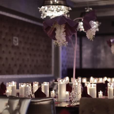 decorative candles burning on a banquet table