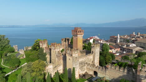medieval castle by lake garda in summer in lazise village in italy. - aerial shot