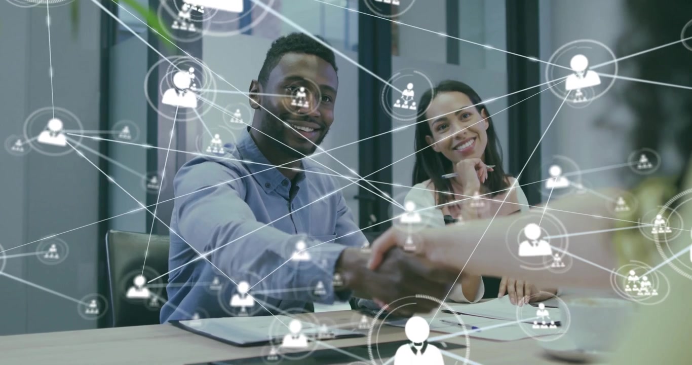 Colleagues discussing business strategy in modern conference room, with floating network icons