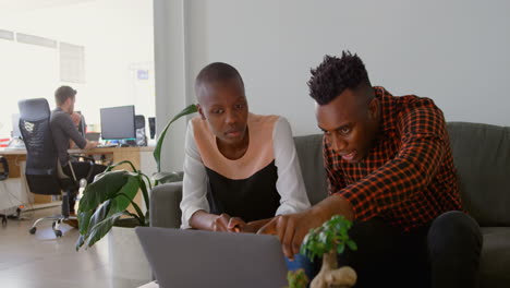 front view of young black business team planning and sitting the on couch in office 4k