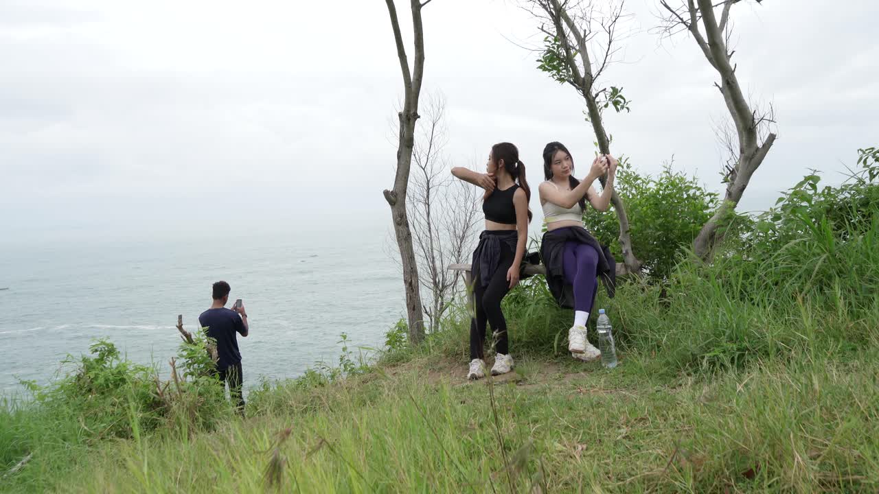 Friends enjoying a scenic hike by the ocean