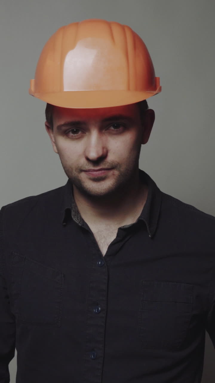Concept of male engineer. Civil construction worker, builder, architect on gray background