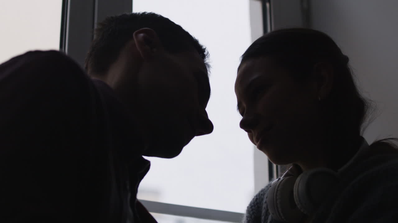 Couple in Silhouette by Window