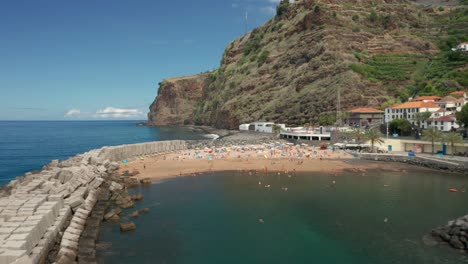 summer holiday destination of calheta beach on atlantic ocean shore of madeira