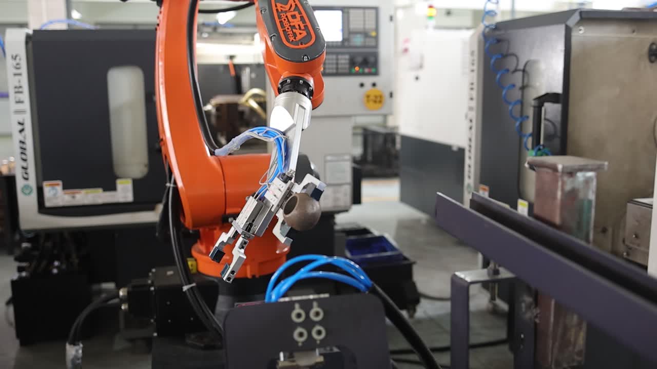 robotic arm putting a raw material on the machine. Industry 5.0, industrial 4.0 concept
