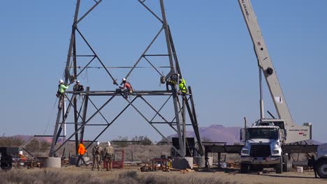 american workers assemble high tension electrical transformers and cables to build us infrastructure 1