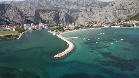 aerial pullback from canal beach and river tributary in omis hrvatska