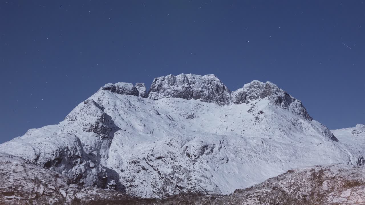 St&oslash;vla illuminated by the full moon and northern lights, Lofoten, time lapse