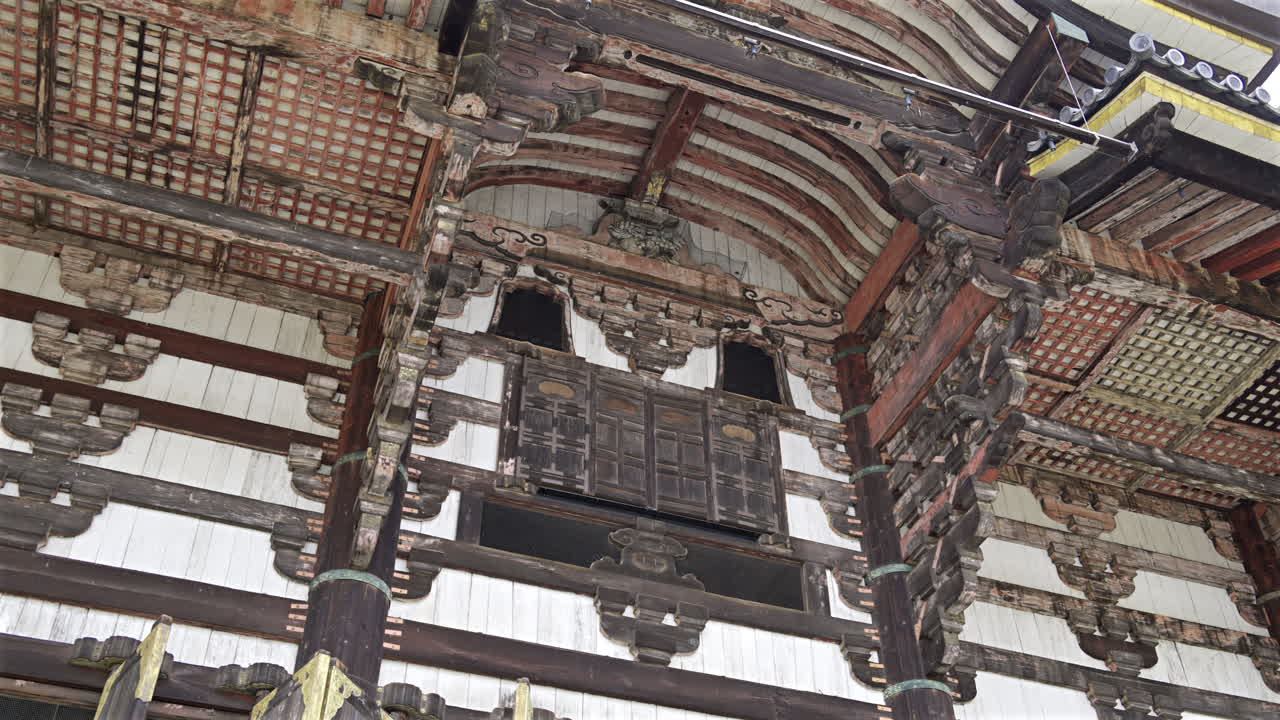 Todai-ji buddhist temple reveals detailed craftsmanship and ornate features. This unique architectural style reflects Japan's rich cultural heritage. The Great Buddha Hall