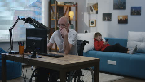 grandfather and grandson learning together at home