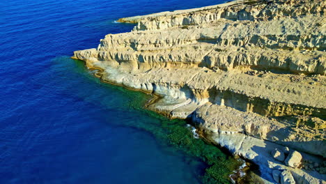 drone view of venetian fortezza castle perched on paleokastro hill by sea in rethymno, crete