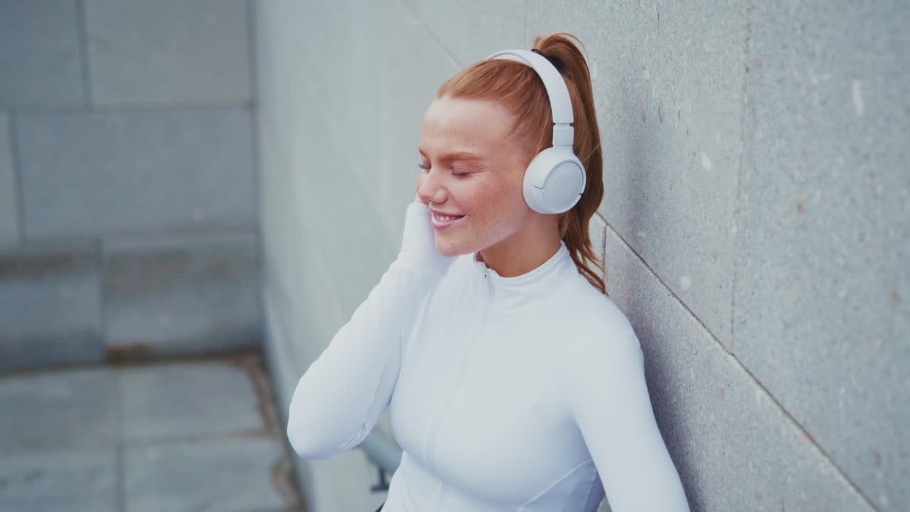 Woman in Sportswear with Headphones