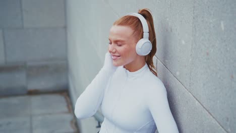 woman in sportswear with headphones