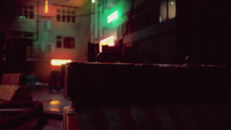 a dark, deserted alleyway in a futuristic city with neon signs, a rusted barrier in the foreground