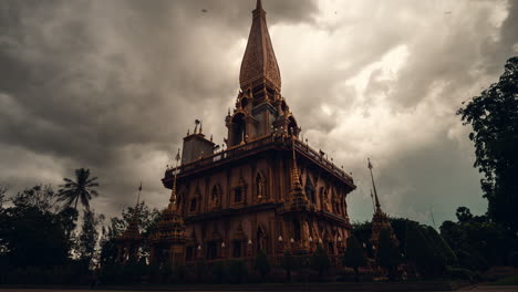 thai temple architecture under a cloudy sky