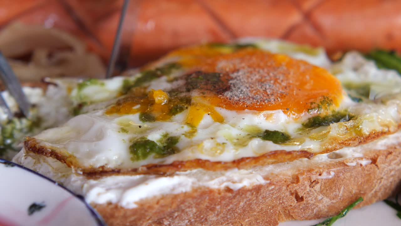 Egg on toast with sausage