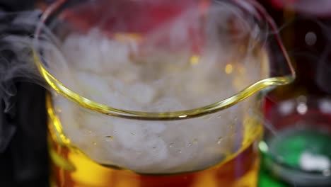 dry ice reacts in beaker, producing smoke