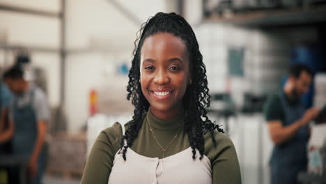 happy african american woman in a factory