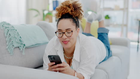 Woman,-phone-and-lying-on-sofa-chatting