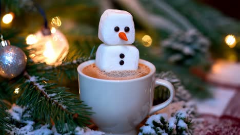 marshmallow snowman in a cup of hot chocolate