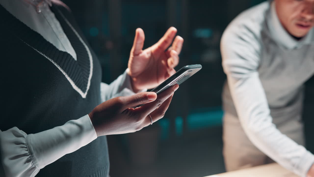 People working together in office using smartphone
