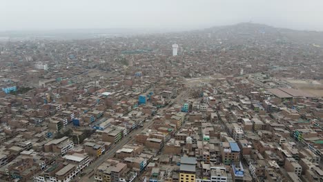 aerial shot of ventanilla, a crowded and poor slum in lima, peru