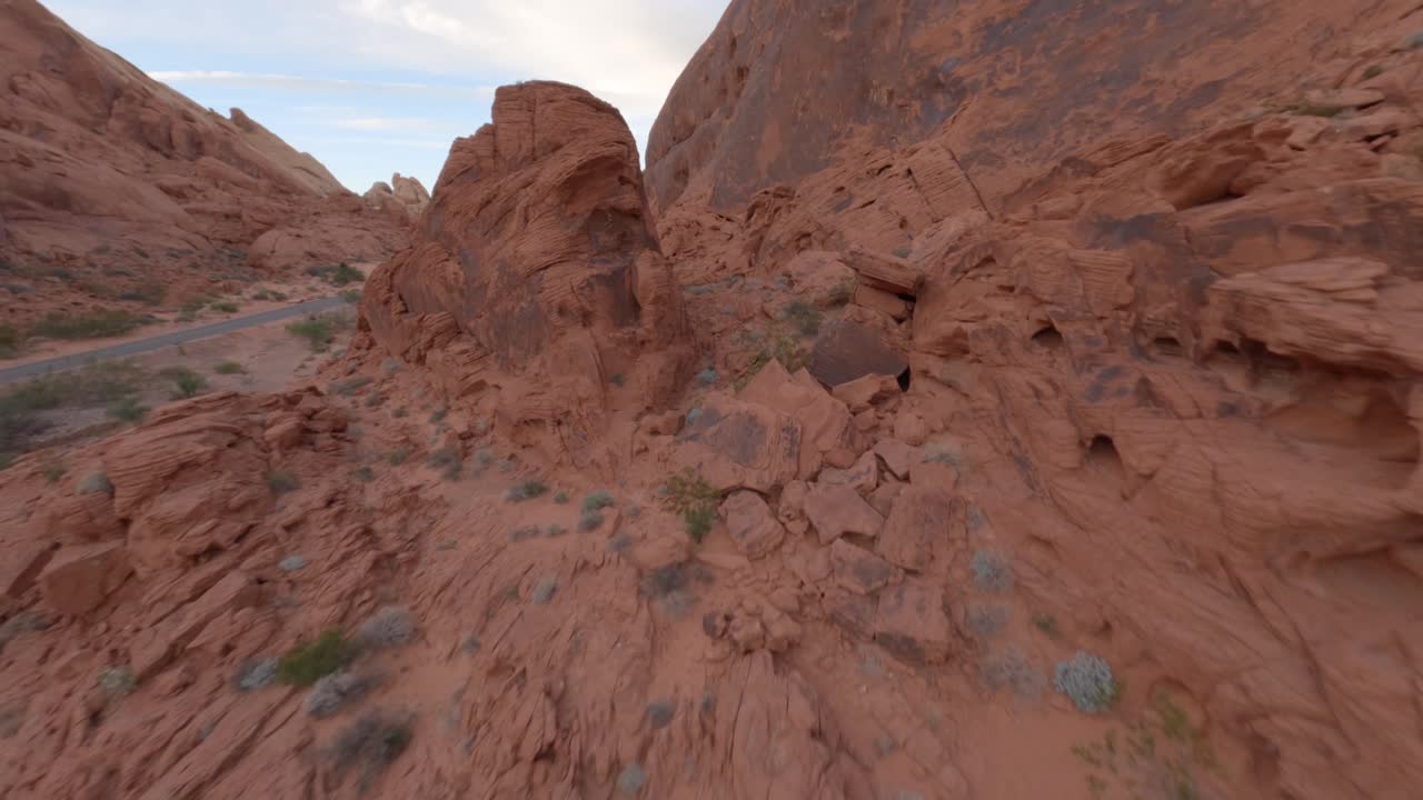 FPV aerial, ridge surfing approaching car parked at road